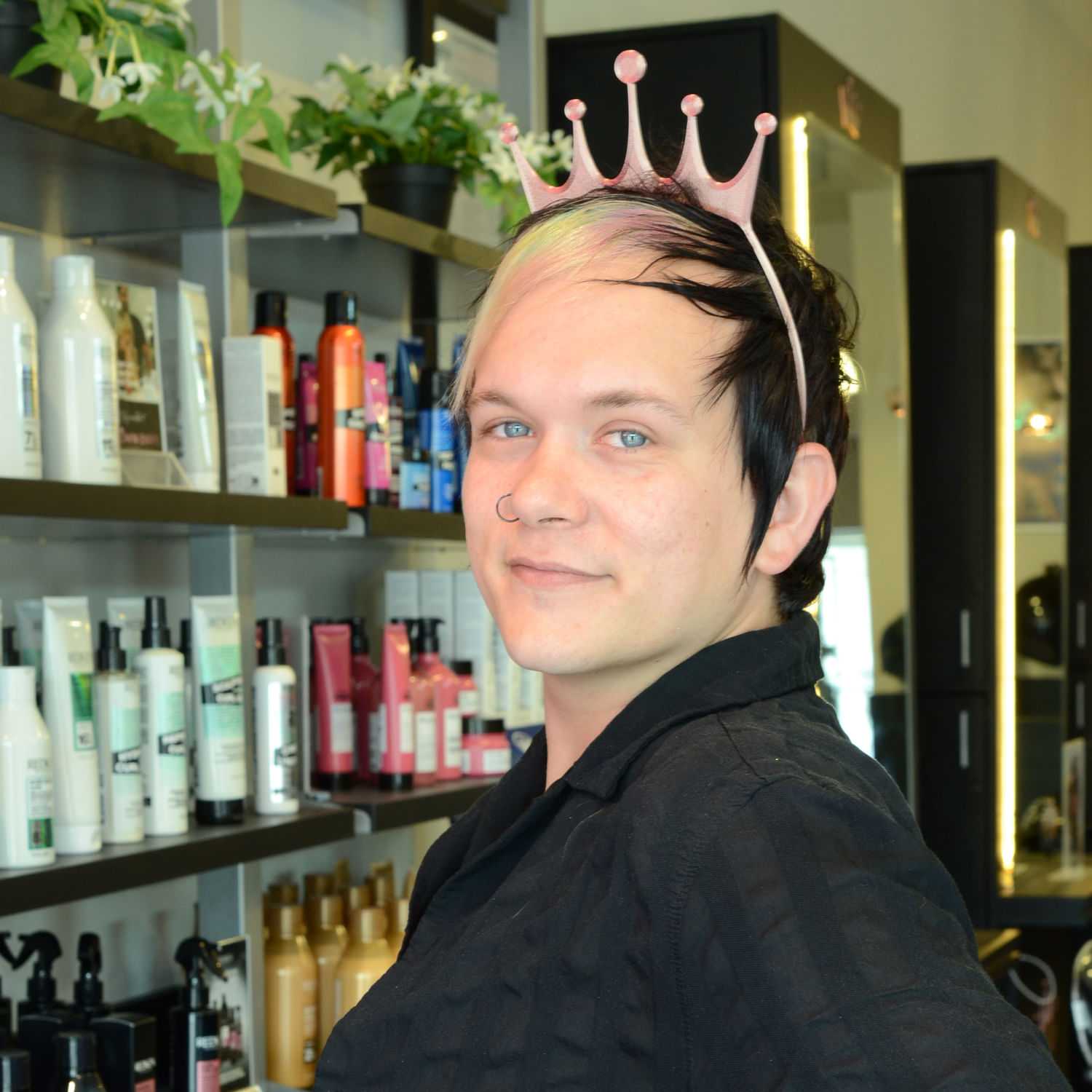 Portrait of Trevor S., a professional stylist at Crown Envy, showcasing their expertise and style.