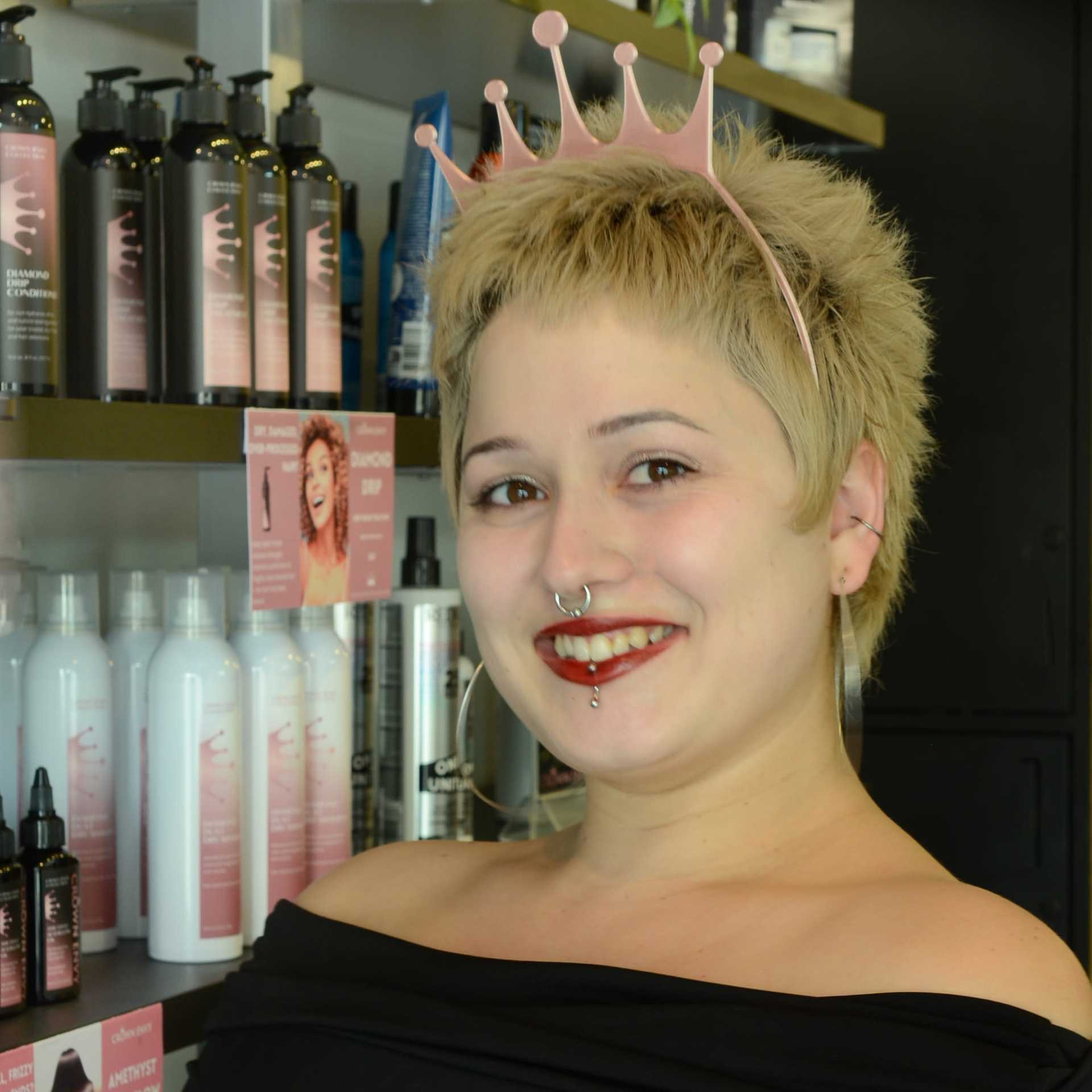 Portrait of Alexus A., a professional stylist at Crown Envy, showcasing their expertise and style.