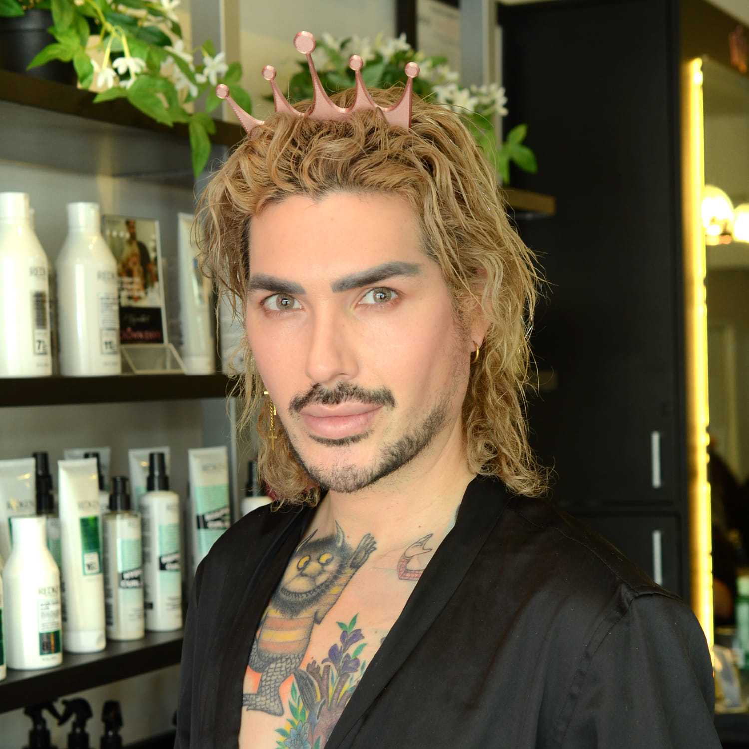 Portrait of Travis S., a professional stylist at Crown Envy, showcasing their expertise and style.