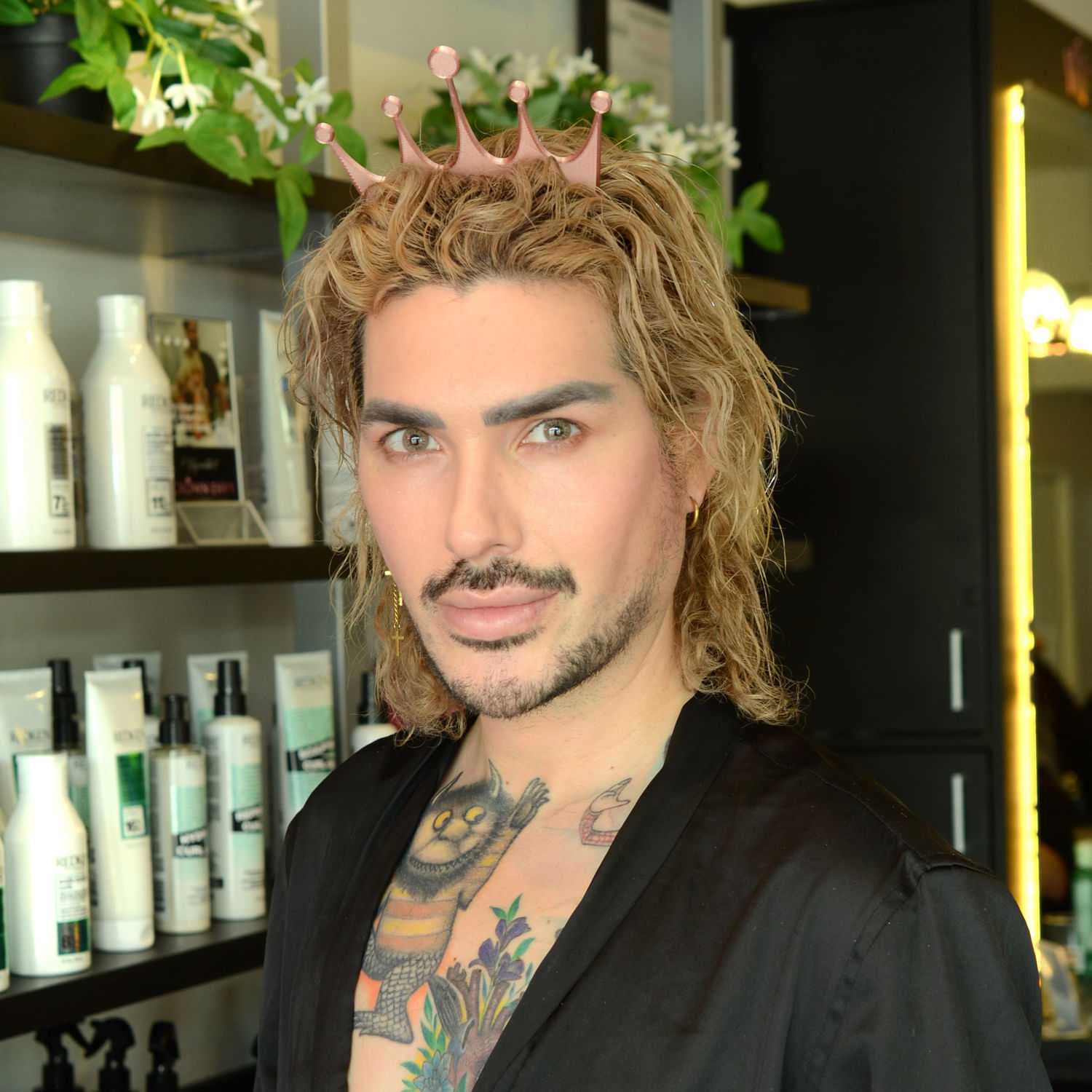 Portrait of Travis S., a professional stylist at Crown Envy, showcasing their expertise and style.