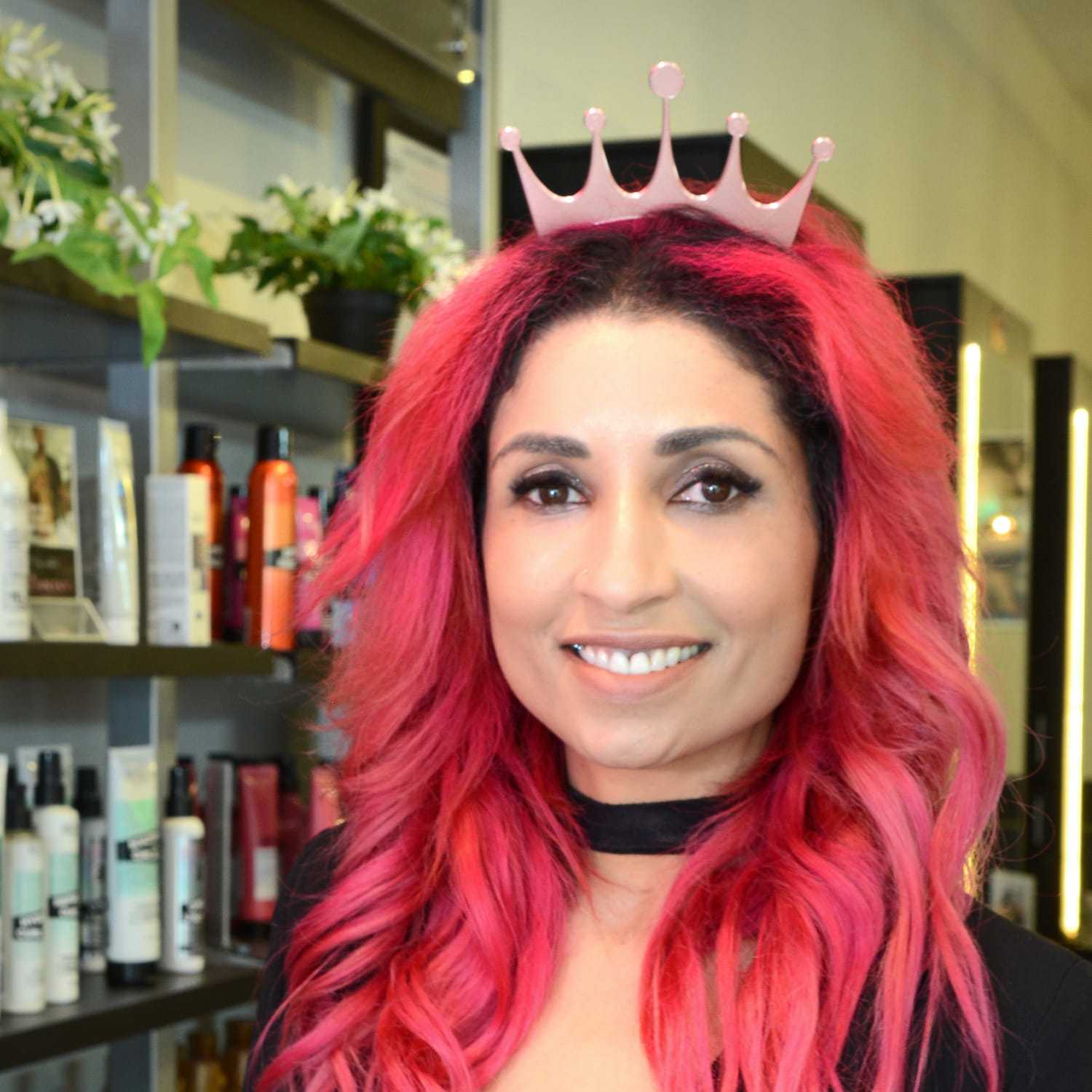 Portrait of Toni R., a professional stylist at Crown Envy, showcasing their expertise and style.